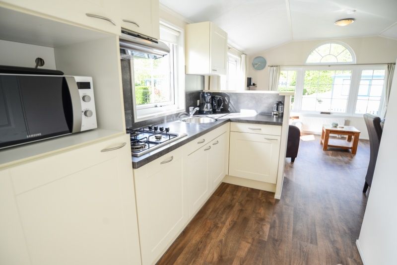 Fully equipped kitchen in Holiday Park De Koorn-aar Type F, Texel, with modern amenities.