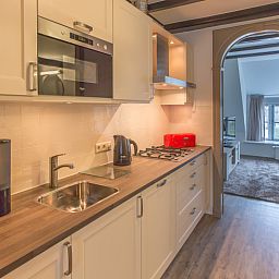 Moderne Kueche im Typ X-7 Ferienhaus De Cocksdorp Texel mit Einbaugeraeten