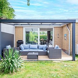 Terrace of Bungalow Duin aan Zee Texel at Bungalowpark Tamarisk, located in the serene surroundings of De Cocksdorp.