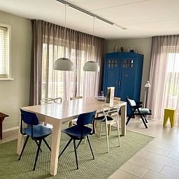 Dining area with view in Frederik and Lodevika vacation home, De Cocksdorp, Texel, Wadden Islands.