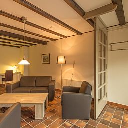 Gezellige woonkamer van Type S-2 vakantiehuis in De Cocksdorp, Texel met comfortabele zitruimte.