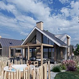 Uitzicht op de tuin en hot tub bij Chalet in De Cocksdorp, Texel, Waddeneilanden.