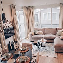 Cozy living room of Chalet Bregkoog 119 on Texel, perfect for relaxation in De Koog, Wadden Islands.