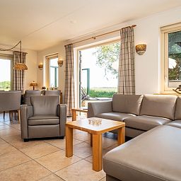 Bright and spacious indoor space in Villa, De Koog, Texel overlooking the nature of the Wadden Islands.