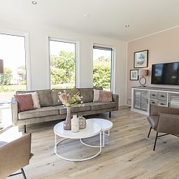Stylish living room in Villa 35a, De Koog, Texel with lots of natural light.