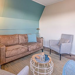 Spacious living room in Apartment Zeedistel 22, De Koog, Texel with modern furniture and cozy decor.