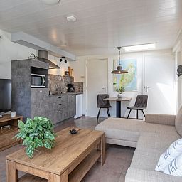 Modern kitchen and dining area in Duo bungalow, vacation home in De Koog, Texel on the Wadden Islands.
