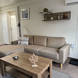 Comfortable living room in Duo bungalow, Texel with stylish decor and modern furniture.