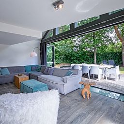 Stylish living room in Park Duynzoom - Villa Duynzoom, Texel, overlooking garden and terrace.