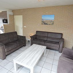 Spacious open kitchen and sitting area in Holiday home Stappeland 207, De Koog, Texel, perfect for family gatherings.