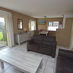 Light and airy living room of Holiday home Stappeland 207 in De Koog, Texel overlooking the garden.