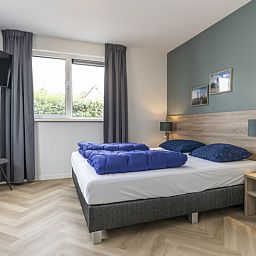 Bedroom in Villa 39, De Koog, Texel. Comfortable vacation home for a relaxing stay on the Wadden Islands.