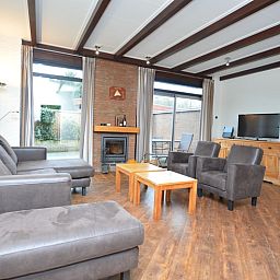 Comfortable sitting area in Orchismient 28 De Koog Texel overlooking the terrace.