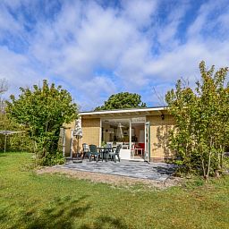 Sunny terrace at Bungalow 51, Bungalowpark 't Luwe Land, De Koog, Texel, ideal for outdoor relaxation.