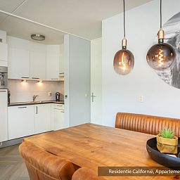 Stylish kitchen in Type 1 vacation home, De Koog, Texel with dining area and atmospheric lighting.