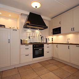 Functional kitchen equipment in Villa with Conservatory, Texel.
