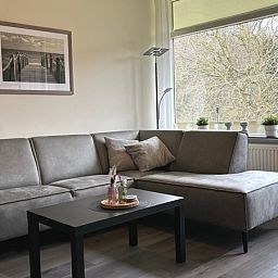 Comfortable sitting area in Apartment Kerckeland 40, De Koog, Texel with green surroundings.