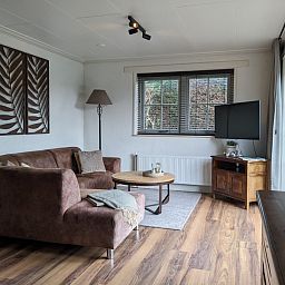 Cozy living room in D' Duinster vacation home, De Koog, Texel with comfortable seating area on the Wadden Islands.