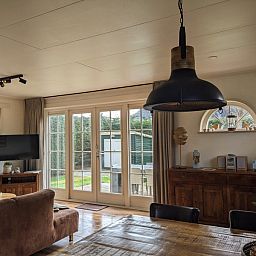 Bright living space in D' Duinster vacation home, De Koog, Texel overlooking garden on the Wadden Islands.