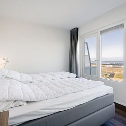 Bedroom in Apartment Juliana 154 Zeezicht, De Koog, Texel with comfortable bed and beautiful sea view.