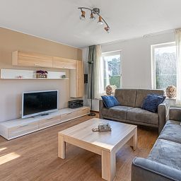 Moderne Sitzecke im Ferienhaus Honeysuckle 97, De Koog, Texel, ideal fuer einen entspannten Aufenthalt auf den Watteninseln.