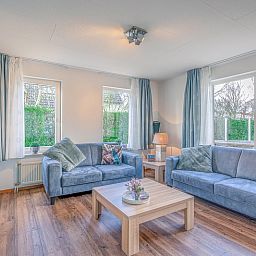 Cozy living room of Holiday home Kamperfoelie 55 in De Koog Texel with modern furnishings.