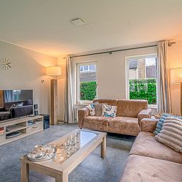 Modern living room with television in Holiday home Honeysuckle 45, De Koog, Texel.