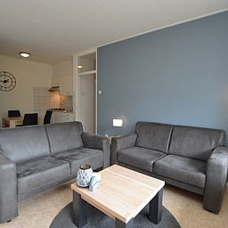 Cozy sitting area in Apartment Kerckeland 122, De Koog, Texel with stylish furniture.