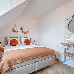 Cozy bedroom in Windlust vacation home, De Koog, Texel with modern furnishings