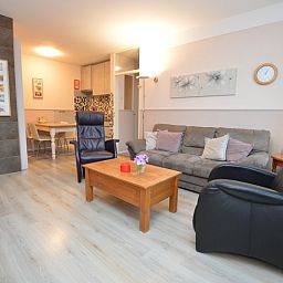 Spacious interior of Apartment Kerckeland 70, vacation accommodation in De Koog, Texel with open kitchen.