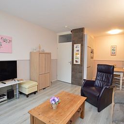 Modern dining and sitting area in Apartment Kerckeland 70, vacation accommodation in De Koog, Texel.