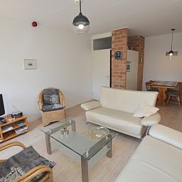 Spacious living room with television in Apartment Kerckeland 80, De Koog, Texel, perfect for cozy evenings.