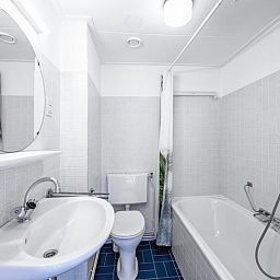 Fresh bathroom in Two persons apartment large - second floor, De Koog, Texel with bath and shower.