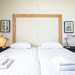 Comfortabele slaapkamer in Appartement - 4-persoons (1533) in De Koog, Texel, perfect voor een ontspannen nachtrust.