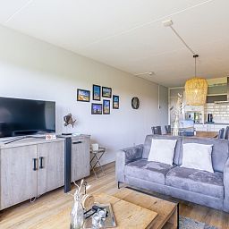 Open-plan living and dining area in Apartment Juliana 042, located in De Koog, Texel, with modern facilities.