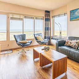 Bright living room of Apartment Juliana 168 Zeezicht, De Koog Texel, overlooking the dunes and sea.