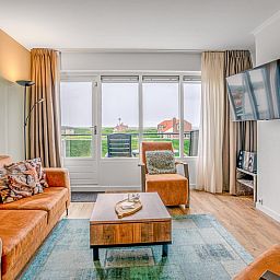 Comfortable seating area in Apartment Juliana 136 with sea view in De Koog, Texel.