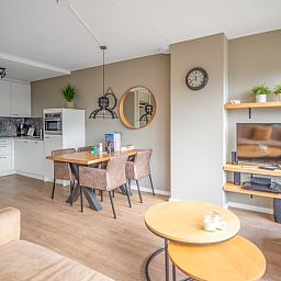 Dining area and kitchen in Apartment Juliana 178 Eilandzicht, De Koog, Texel, ideal for family dinners.