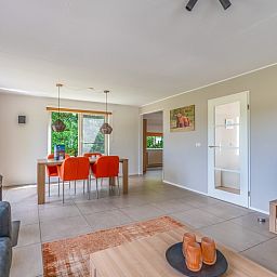 Dining room in Holiday home Honeysuckle 69 with sauna, De Koog, Texel, with stylish decor and lots of natural light.