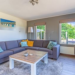 Cozy living room of Holiday home Kamperfoelie 71, De Koog, Texel with comfortable sofa.