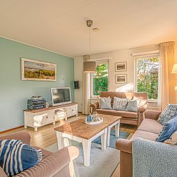 Bright sitting room in Holiday home Honeysuckle 65, De Koog, Texel, perfect for relaxation.