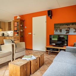 Cozy sitting room in Villa 6 persons with 2 bathrooms, De Koog, Texel. Vacation home with colorful furnishings.