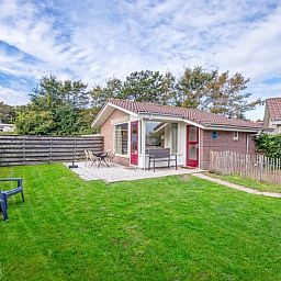 Spacious garden at Het Zandblauwtje vacation home in De Koog Texel