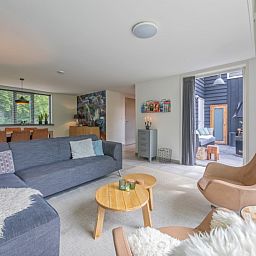 Modern seating area in Holiday Park Het Oude Dijkje - Vuurcoogh, De Koog, Texel with access to the terrace.