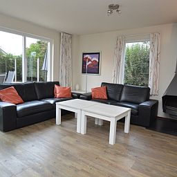 Cozy living room of Holiday home Stappeland 76 in De Koog, Texel with comfortable seating area.