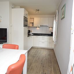 Open kitchen in Holiday home Stappeland 76, De Koog, Texel with modern appliances.