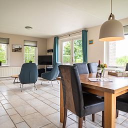 Dining area in Villa sleeps 6, De Koog, Texel. Enjoy meals overlooking the garden in this vacation home on the Wadden Islands.