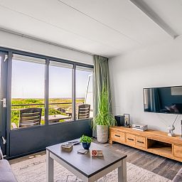 Bright living room of Apartment Juliana 094 Island and Sea View in De Koog, Texel overlooking the Wadden Sea.