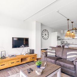 Open kitchen and living room in Apartment Juliana 094 Island and Sea View, De Koog, Texel with stylish decoration.