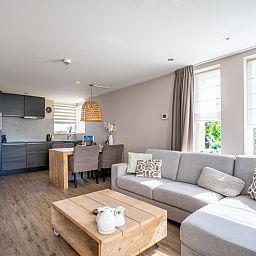 Open kitchen and living room in Apartment Juliana 034 Eilandzicht, De Koog, Texel with lots of natural light.